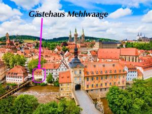 an aerial view of a city with a river and buildings at Gästehaus zur ehemaligen Mehlwaage wohnen und genießen in Bamberg