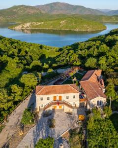 an aerial view of a house with a lake at Bujtina Rragam in Rragam