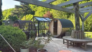 a wooden deck with a play house and a table at Naturerlebnis direkt am Traumpfad in Andernach