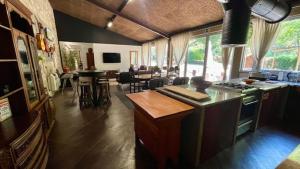 a kitchen and living room with a stove top oven at Quinta dos Amores in Ponte de Lima