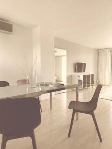a dining room with a table and chairs at Villa Green in Sliač