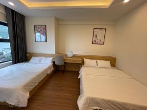 Katil atau katil-katil dalam bilik di FLC SeaTower Quy Nhon +4 gambar