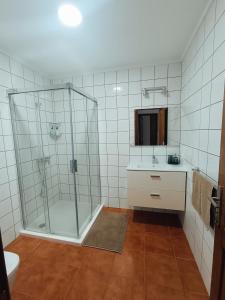 a bathroom with a shower and a sink and a toilet at Casa Rinaifi in Guatiza +20 photos
