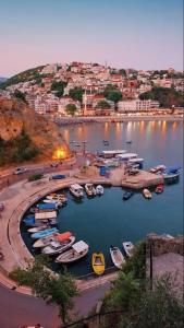 a group of boats are docked in a harbor at royal room in Ulcinj