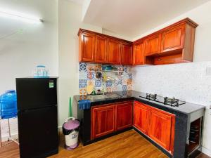 Η κουζίνα ή μικρή κουζίνα στο NY House căn hộ 2pn Gần Biển