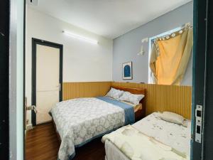 Ένα ή περισσότερα κρεβάτια σε δωμάτιο στο NY House căn hộ 2pn Gần Biển +4 φωτογραφίες