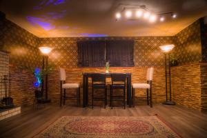 a dining room with a table and chairs in a room at Spacious vintage styled basement apartment - private in Calgary