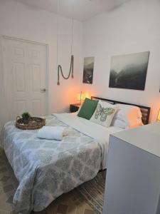 a bedroom with two beds and a door at The White Point in San Juan