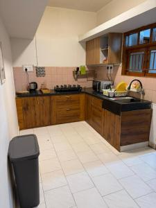 Η κουζίνα ή μικρή κουζίνα στο 2BHK Cozy stay Indranagar