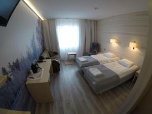 Postel nebo postele na pokoji v ubytování Hotel Ivalo