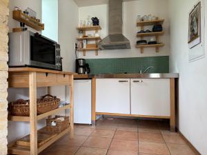 Η κουζίνα ή μικρή κουζίνα στο Ferienhaus in ehemaliger Scheune