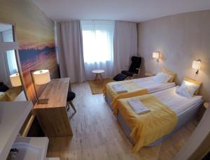 Postel nebo postele na pokoji v ubytování Hotel Ivalo