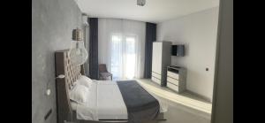 a bedroom with a bed in a room at Suite Pool Golful Francez in Schitul +16 photos