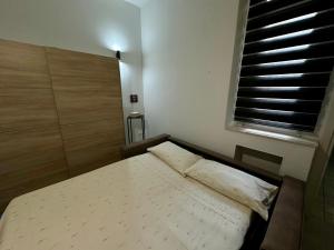 Ένα ή περισσότερα κρεβάτια σε δωμάτιο στο Olbia Terranova - Apartments