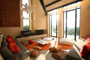 a living room with a couch and a table at Elegant Villa Escape in San Jose, 1036 in San Jose