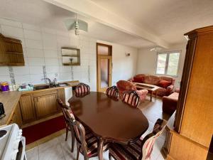 a kitchen and dining room with a table and chairs at Stari grad Kuca in Sarajevo +5 photos