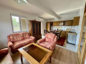 a living room with two couches and a table at Stari grad Kuca in Sarajevo