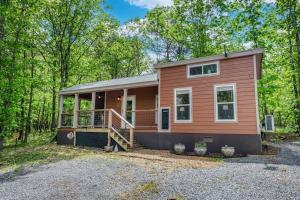 a tiny house in the woods at Mentone Tranquility Base with Hot Tub in Mentone
