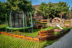 a garden with a playground and a swing at Chochołowska Zagroda in Chochołów