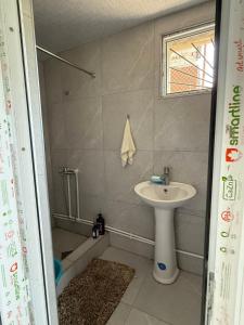 a bathroom with a sink and a bath tub at Край отдыха дзорахбюур in Yerevan