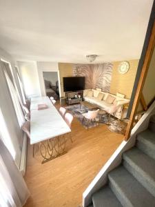 a living room with a couch and a table at Royal View Frontenac Balconies 6 bedrooms 15 guests in Lévis