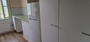 a white refrigerator and freezer in a kitchen at Pankkikallio 7 in Sorsakoski