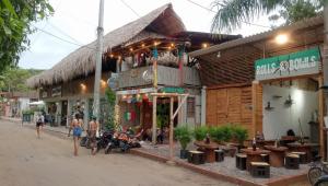 a group of people walking in front of a building at Cabañas Casa Fany in Palomino