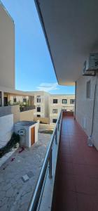 a view of a balcony of a building at Sunset Hotel Roza in Vlorë