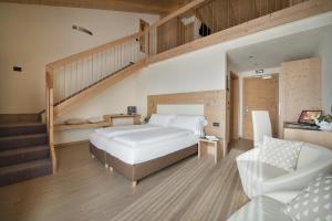 Postel nebo postele na pokoji v ubytování Hotel Silvestri