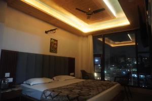 A bed or beds in a room at Anand residency