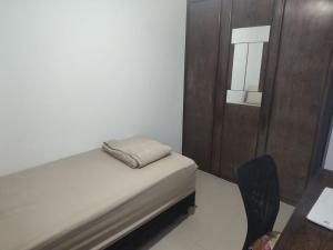 Postel nebo postele na pokoji v ubytování Quarto Aconchegante 2