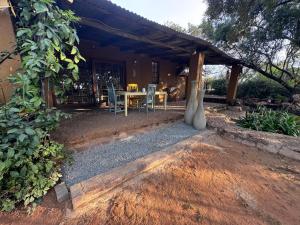a table and chairs in front of a house at Bushbaby in Centurion