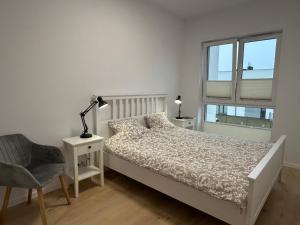 Postel nebo postele na pokoji v ubytování Spirit of the Sea Apartment