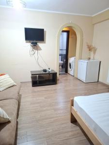 Μια τηλεόραση ή/και κέντρο ψυχαγωγίας στο Apartment Nebula Rooms
