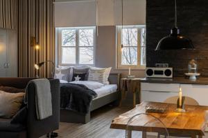Un pat sau paturi într-o cameră la Ferienhaus Loft in der alten Schreinerei