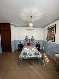 a bedroom with a bed with a red laptop on it at Residenza Dei Parchi in Sondrio