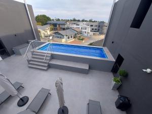 an overhead view of a swimming pool on a building at 310 The Meadows in George