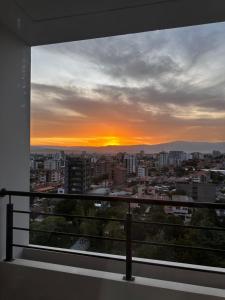 a view of a sunset from a balcony at Exclusivo Departamento! in Cochabamba