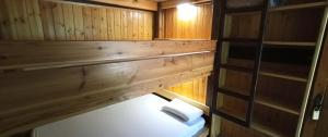 an inside view of a cabin with wood paneling at Camping Collegats in La Pobla de Segur +12 photos