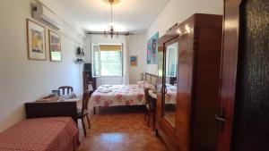 Postel nebo postele na pokoji v ubytování B&B Tou Lì