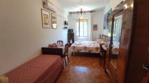 Postel nebo postele na pokoji v ubytování B&B Tou Lì