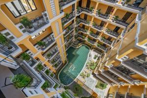 an overhead view of an apartment building with a swimming pool at Soluna D'Annam - The Art of Hoi An Relaxation - formerly Hoi An Babylon Riverside Hotel in Hoi An