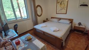 Postel nebo postele na pokoji v ubytování B&B Tou Lì