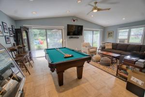 a living room with a pool table in it at Catskills Getaway 3BR Retreat with Media Room, Near Casino, Bethel Woods and More in Glen Wild