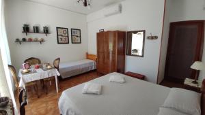 Postel nebo postele na pokoji v ubytování B&B Tou Lì