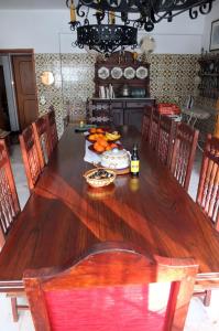 a wooden table with a bunch of food on it at Vila Candeias, Vilamoura, Algarve, Beach, 10p in Quarteira