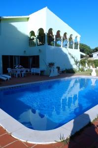 a swimming pool in front of a house at Vila Candeias, Vilamoura, Algarve, Beach, 10p in Quarteira