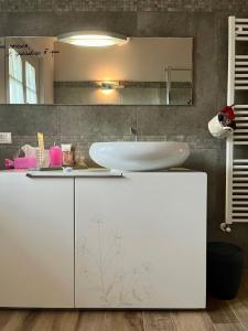 a bathroom with a sink and a white cabinet at Agriturismo Tenuta Il Molino in Quercianella