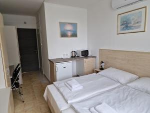 Postel nebo postele na pokoji v ubytování Lencsés Apartmanház Apartmanok