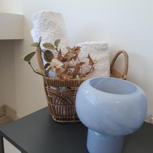 a basket and a bowl on a table at Balkan Tower Deluxe Candy in Gabrovo +30 photos